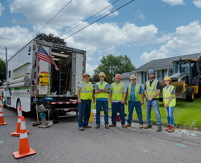 HG&E's Gas Crew standing in front of their vehicles