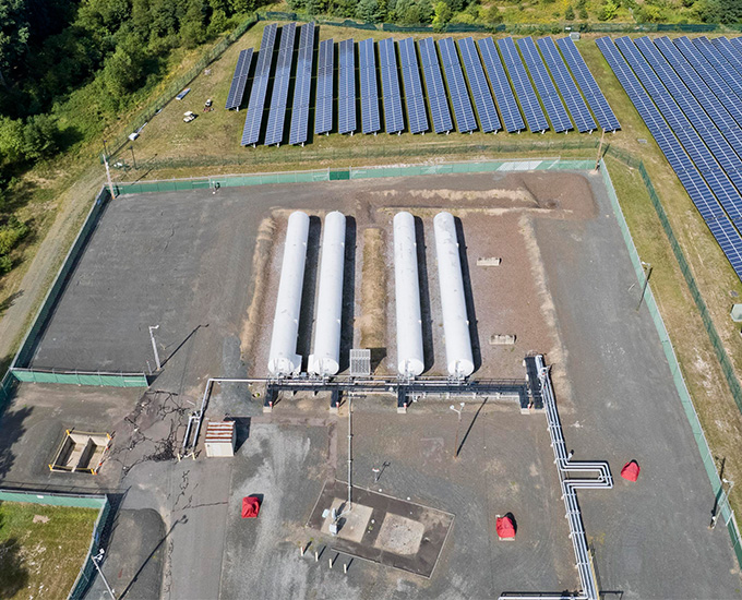 Image of the LNG plant overlooking 4 tanks the footprint for a fifth tank